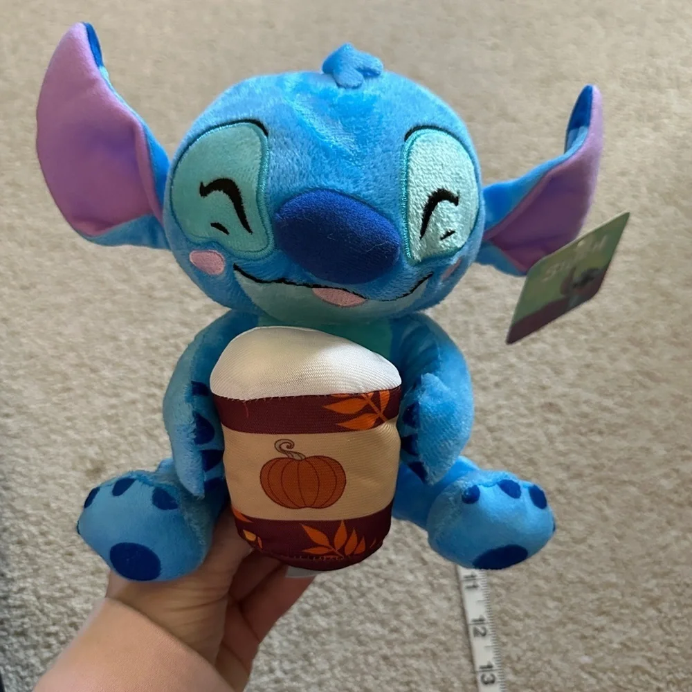 Stitch holding a coffee